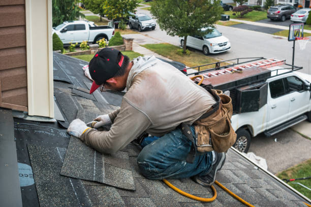 Professional Roof Repair technician working in Bay City, OR